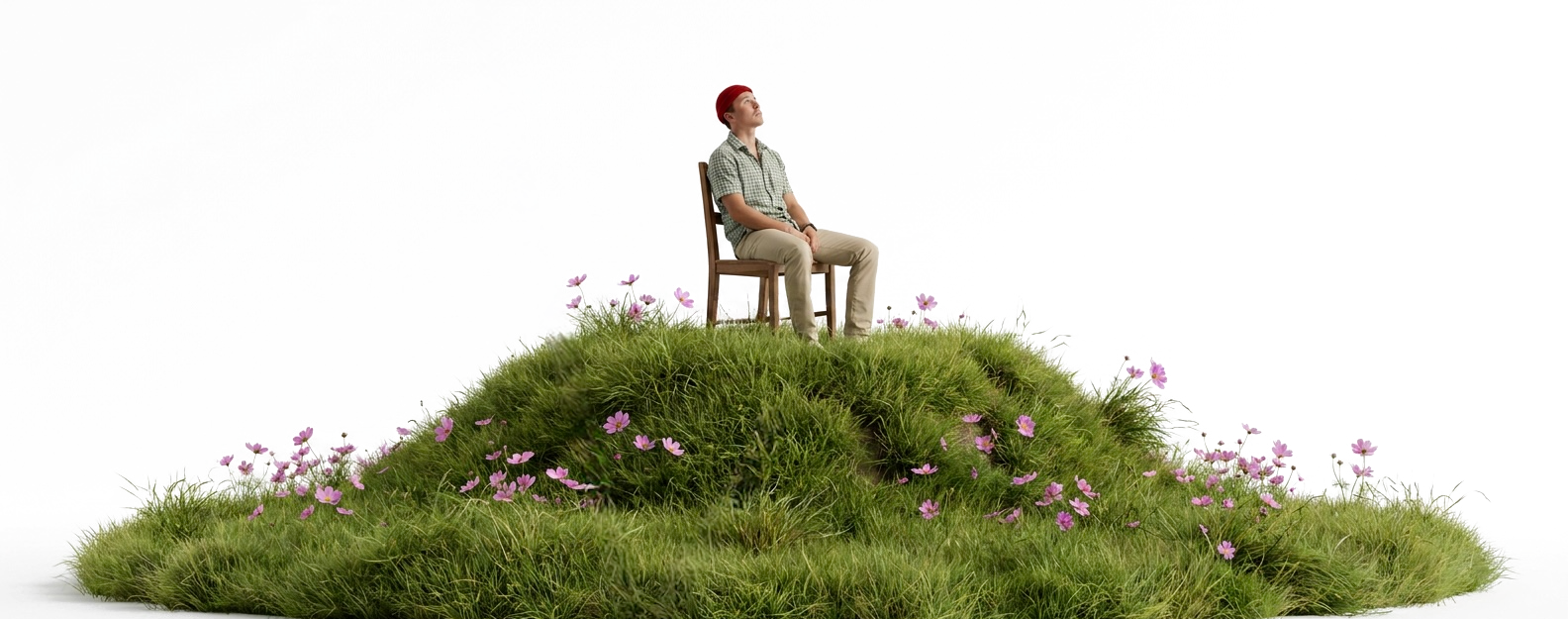 cody dzurisin sitting on a chair on a grassy hill